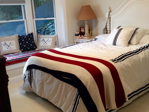 Main bedroom with the window overlooking waterfall in late