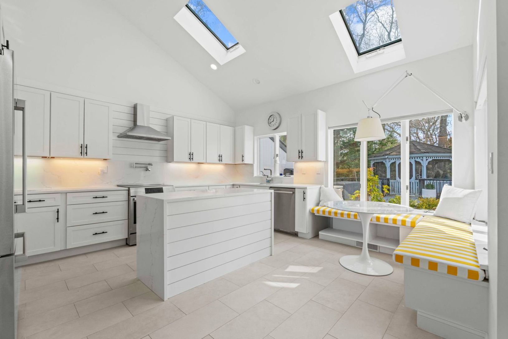 New Chefs Kitchen featuring a kitchen island, high-end appliances all with stainless steel finishes