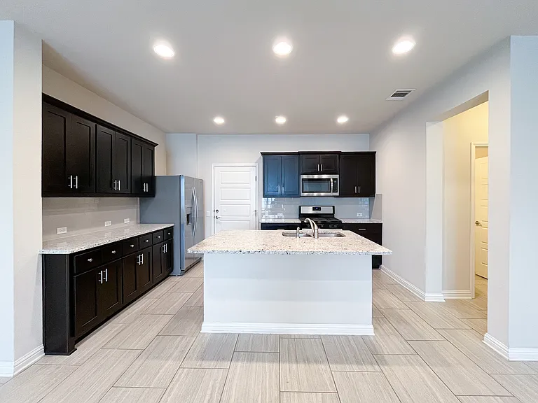 Modern kitchen with stainless appliances and lots of cabinet storage