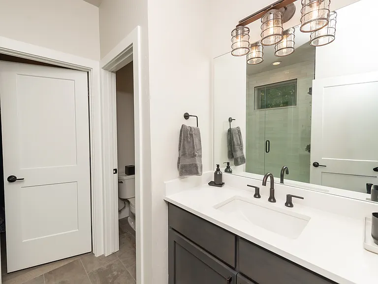 Full bathroom off the bunk bedroom with a spacious walk-in closet_offering comfort, convenience, and plenty of storage