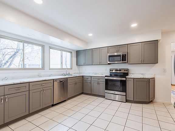 Kitchen will stay bright year-round with 4 large windows and bright, recessed lights overhead.