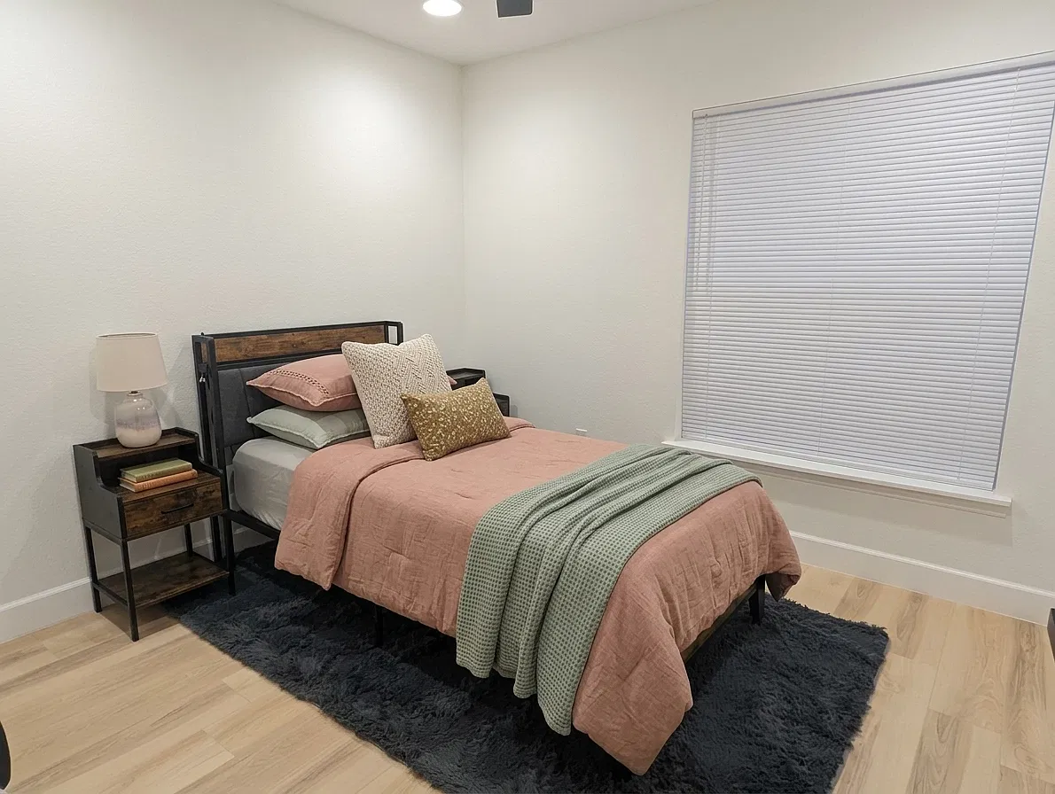 Bedroom 1 on the first floor comes with a closet, ceiling fan, lock & key nightstand for valuables, and a darkened window for a cool and dark room for a good nights rest.