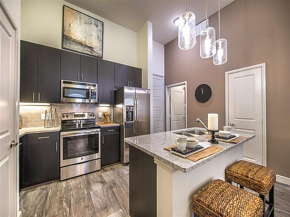 Modern Finishes, Including Sleek Granite Counters and Pendant Lighting