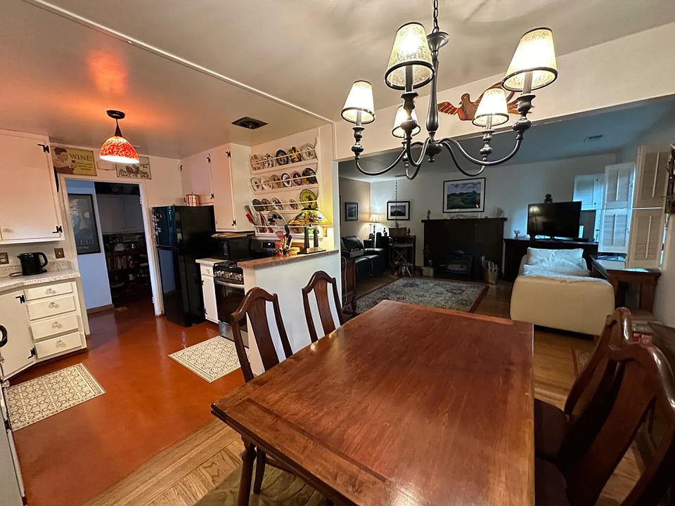 Kitchen, dining and living rooms. (Different dining table and chairs provided).