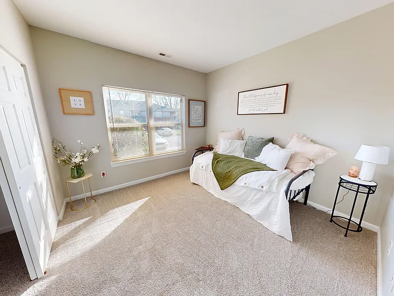 Perfect as a second bedroom, home office, or extra space, with a generous closet and custom shelving.