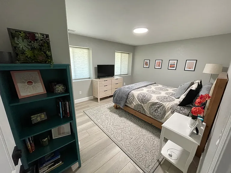 Main bedroom with smart TV connected to 40 local channels