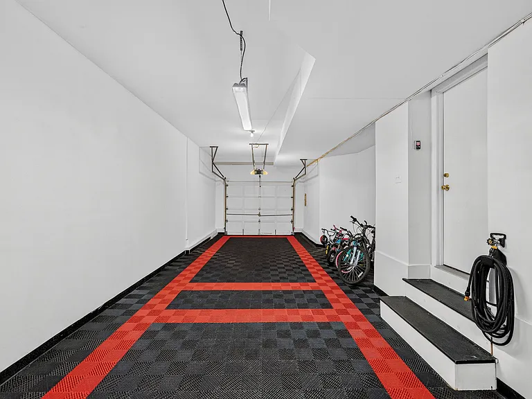 Deep Tandem 2 Car Garage, Fully Finished with high grade flooring tiles and 11 foot ceilings.