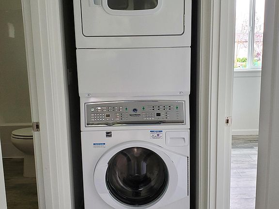 speed queen large capacity bathroom on left bedroom with closet on rt