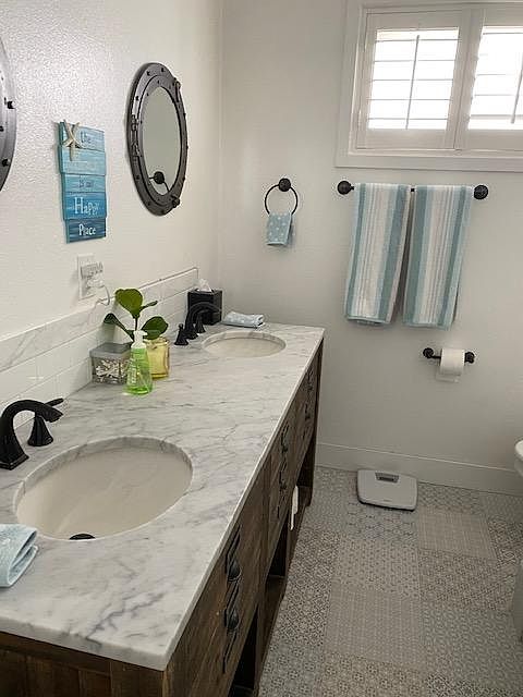 double sink, bidet, bathtub with shower.