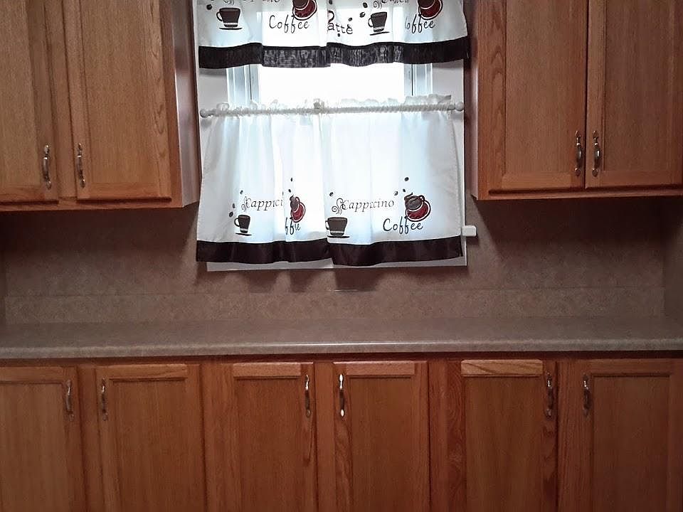 New kitchen cubards sink fixture subfloor and flooring.