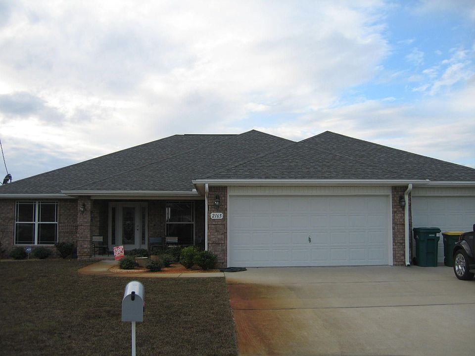 Great home is upscale neighborhood.  Note three car garage!