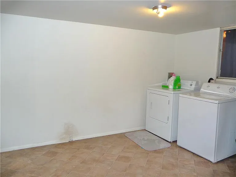 Utility Room w/ Washer & Dryer