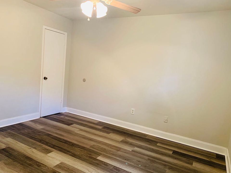 Master bedroom with a half bathroom