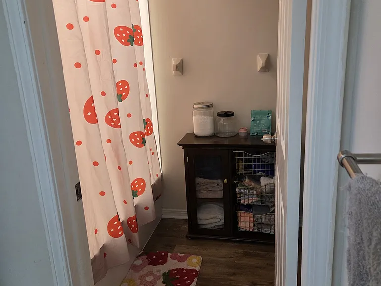 Downstairs bathroom bath/shower room.