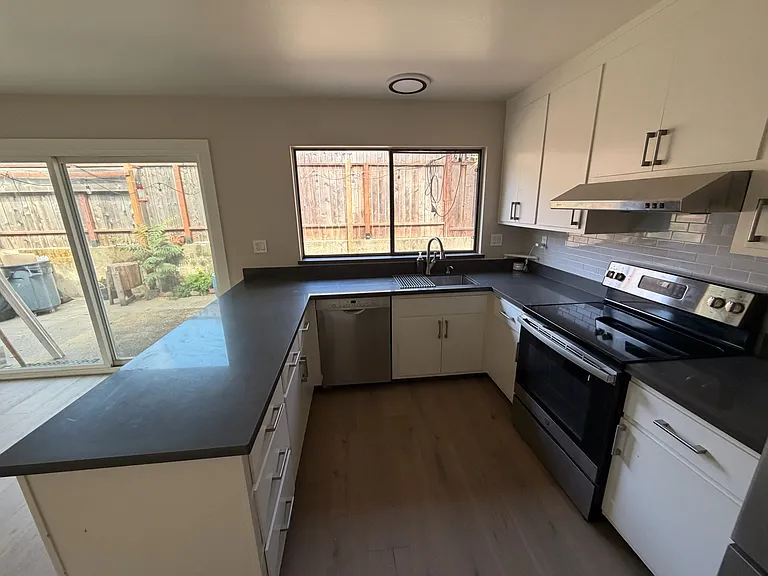 Kitchen with view of outdoor patio