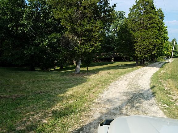 Coming down driveway 