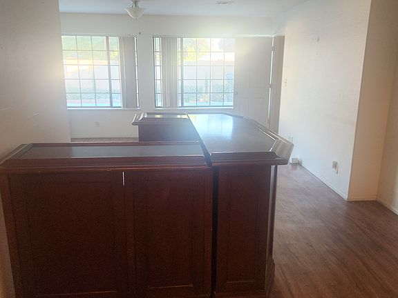 Bar area next to the living room looking out at the pool.