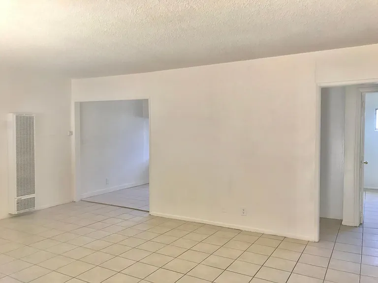 From front door see wall heater & dinning area