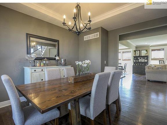 Spread out in this soft contemporary Formal Dining Room. What a pleasant design for those Family Dinners.