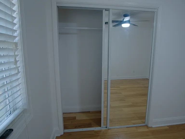 Bedroom 2 with single closet sliding door
