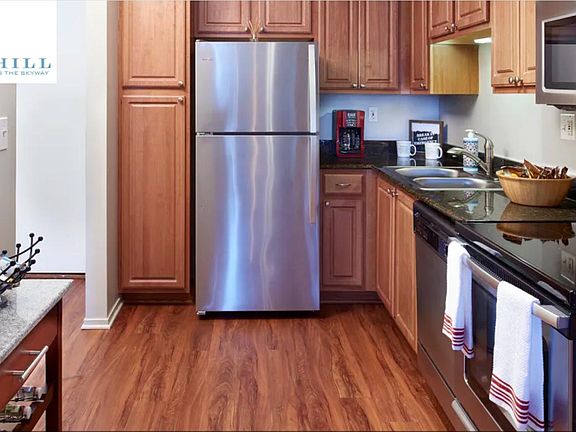 Kitchen with stainless steel appliances and granite countertops.