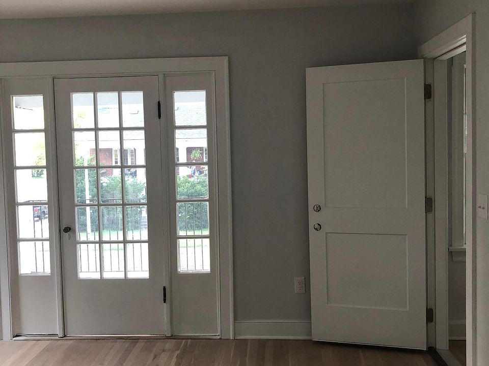 This is your first peek at the living room. The door to the right is the inside door from the hallway. The glass door leads to the front porch.