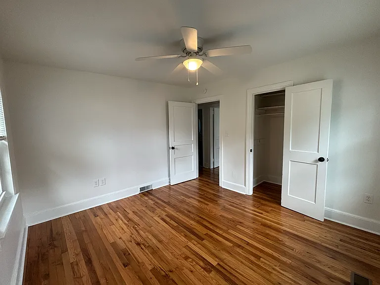 Bedroom 2 (140 sq. ft.) ceiling fan, 2 windows, 1 closet.