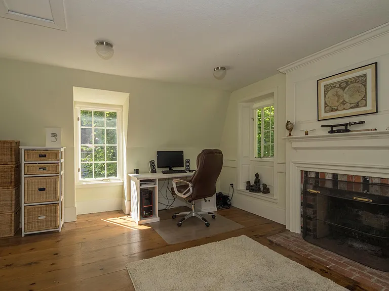 Inlaw bedroom over detached garage, with working fireplace.
