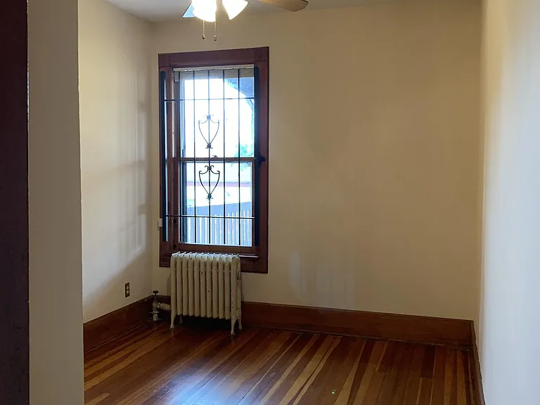 Bedroom 1 faces east. (note: the window air-conditioner fits here with security grill intact)