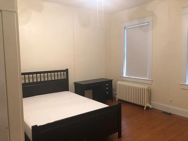 Large 1st Bedroom with two windows facing southeast and a closet. Bed and desk available if desired.