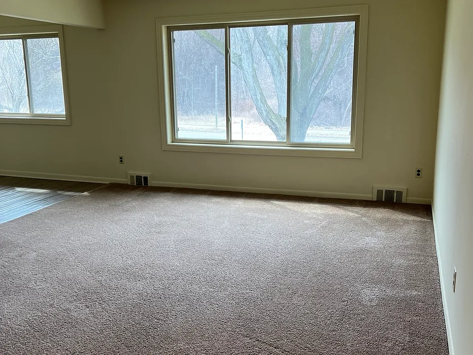 Living room looks out onto bike path along Jefferson.