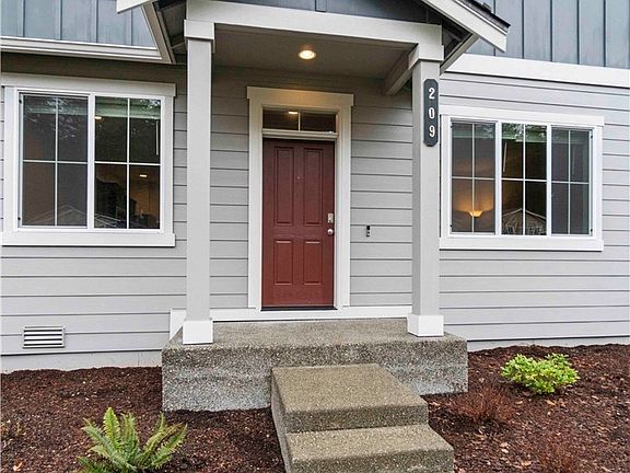 Nice, covered front porch to keep you dry during our rainy season. Home is SMART wired, so it is already wired with a videocam doorbell