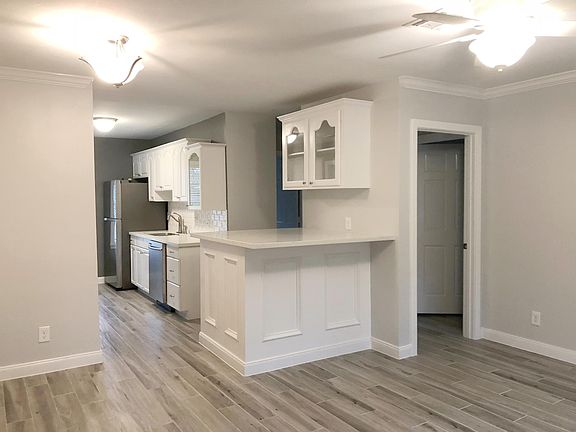 Kitchen opens up to living room. Bar provides extra usable space!