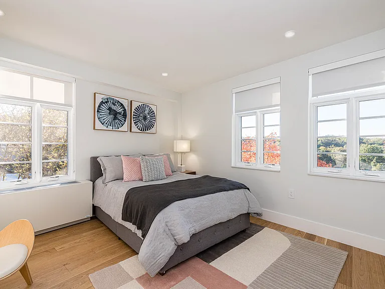 bedroom with hardwood floors and great natural light