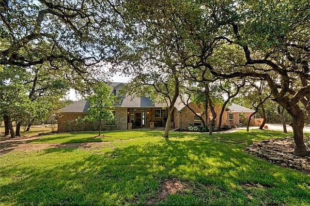 Home is set back off the entry road and along with 50 or so oak trees provides a quiet and private s