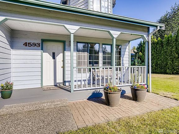 A cute covered front porch greets you as you enter the home.