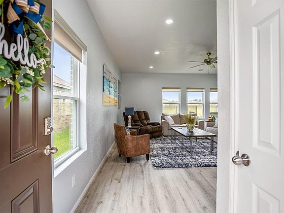 Fresh clean lines greet you as you enter, the home has been freshly painted & has recent Luxury Vinyl Plank (LVP) is waterproof floor that looks like hardwood.