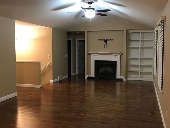 Living Area with Fireplace and Built-in Bookshelves
