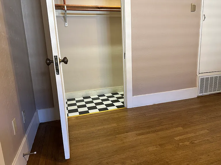 This walk-in closet is in the dining room. The closet to the right is for the central heating system.