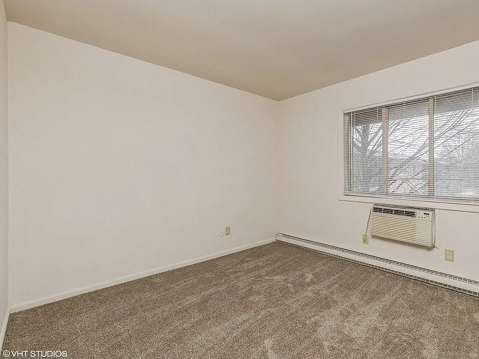 Carpeted Bedroom with Window