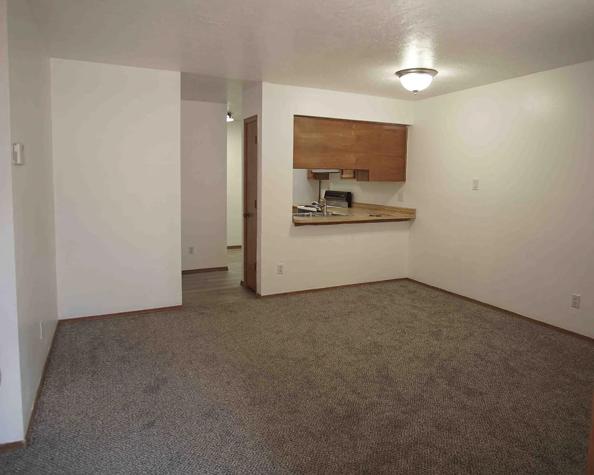 View from front door of Livingroom with Kitchen in background - 12212 Menaul Blvd NE #C