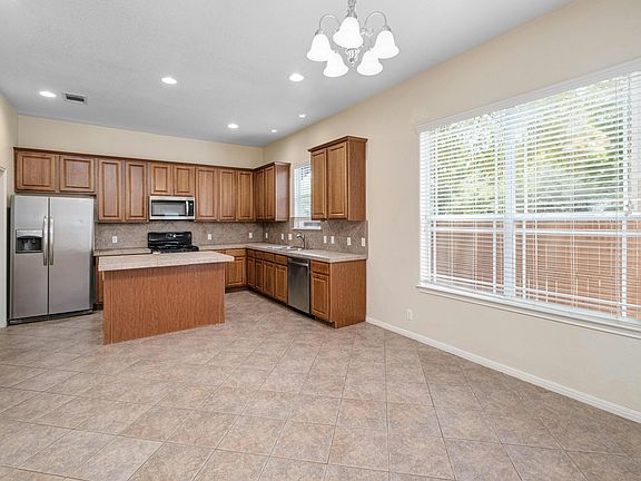 Kitchen with large center island and eat-in dining area.
