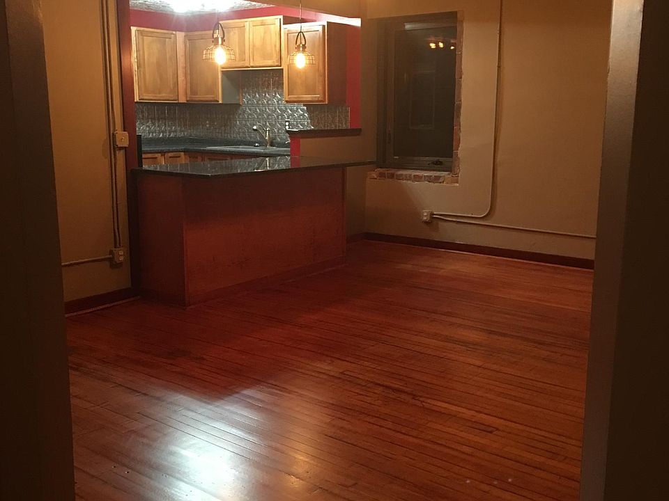 Spacious living area that opens to kitchen.