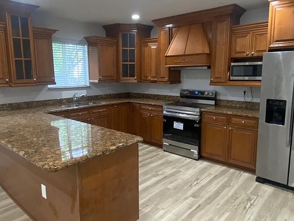 Kitchen with granite countertops and new stove
