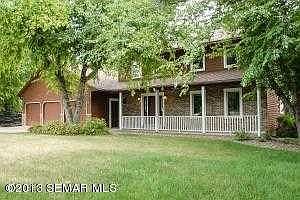 Covered front porch and three-car garage