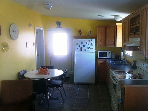 Sunlit dining area off porch