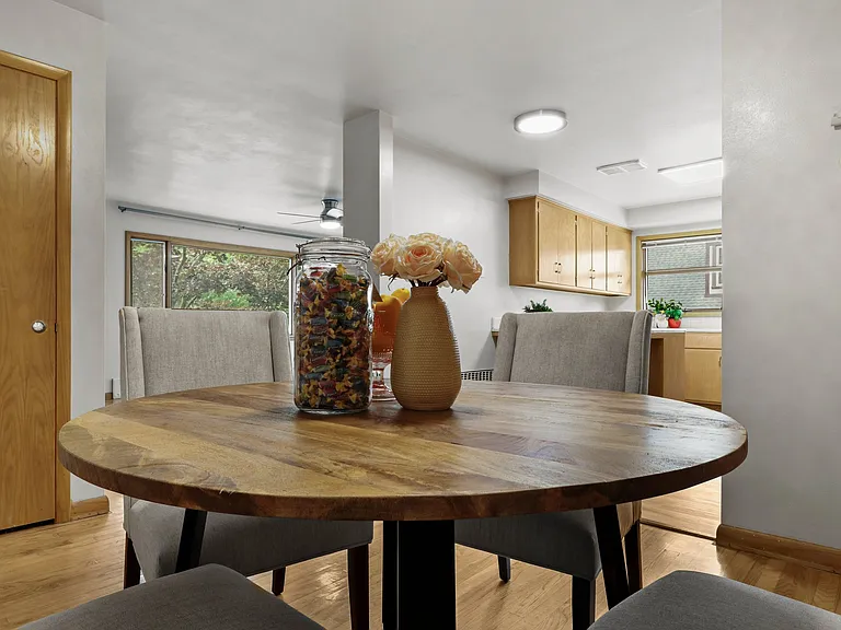 This photo shows an open concept into a large kitchen and you can see the big den window. COOL PLACE BIG too.