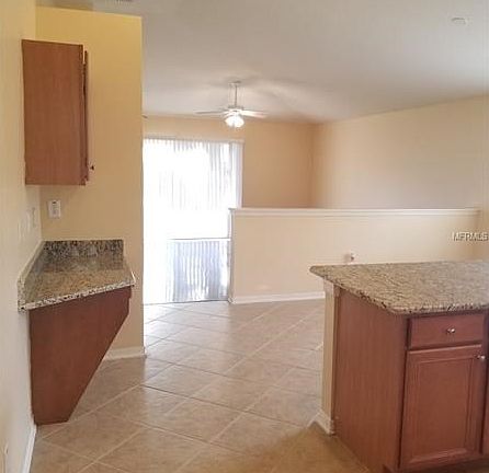 Large kitchen off family room with newly installed granite counter tops.