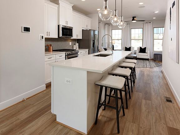 Oversized Island in the Open Kitchen of the New Baywood Home at Crown.