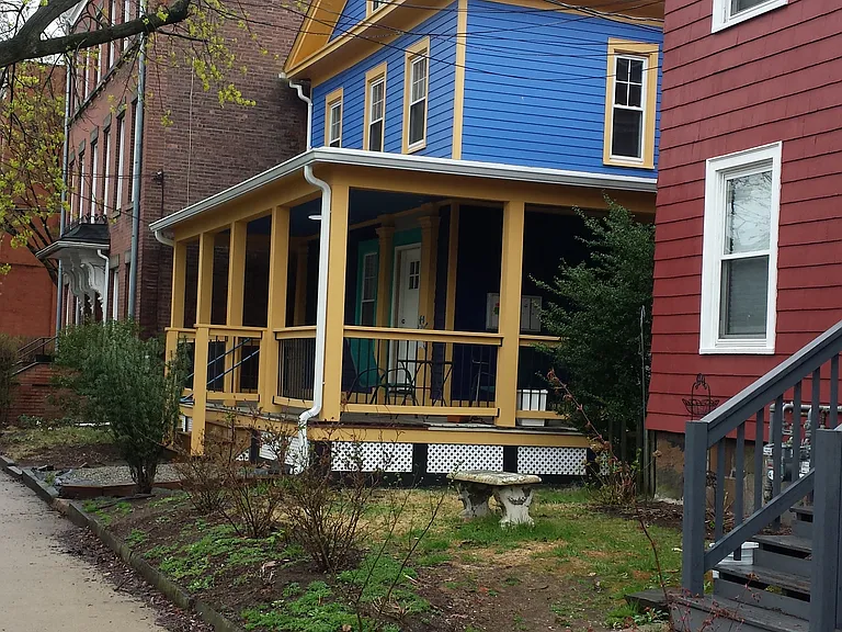Grasses provide privacy to patio area. Garage next to parking lot